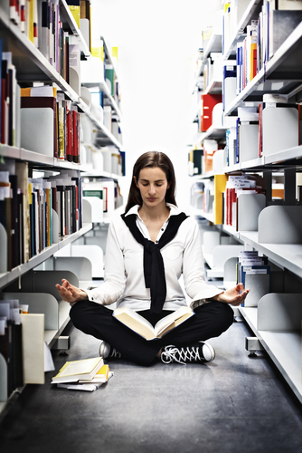 student meditation in library